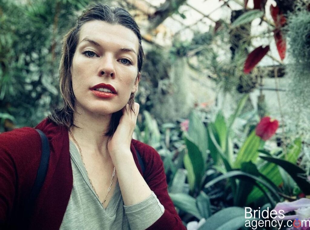 Milla Jovovich selfie in a garden