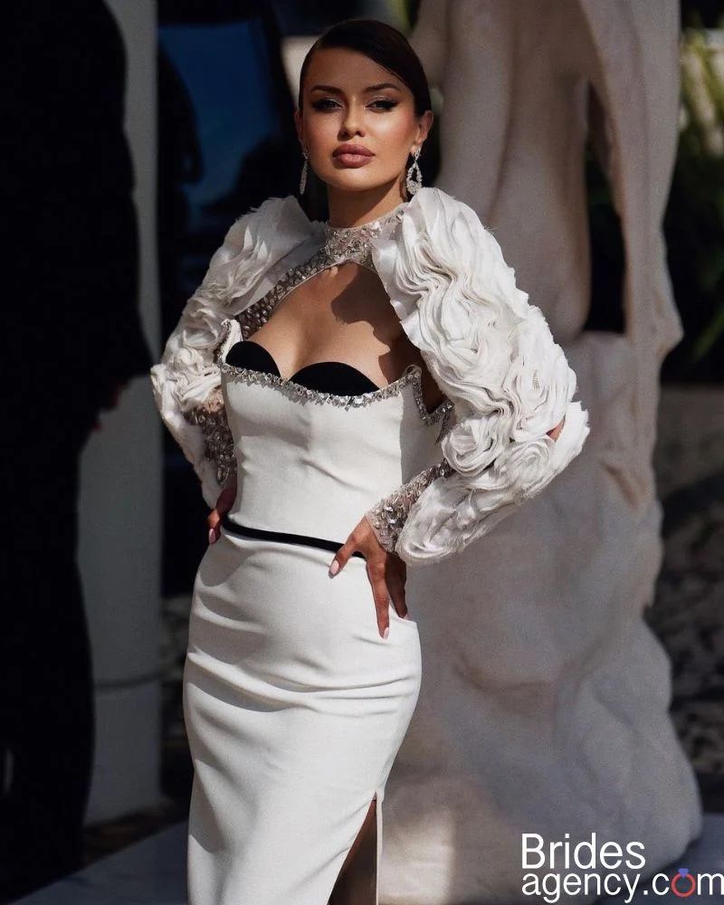Victoria Bonya in an elegant white dress