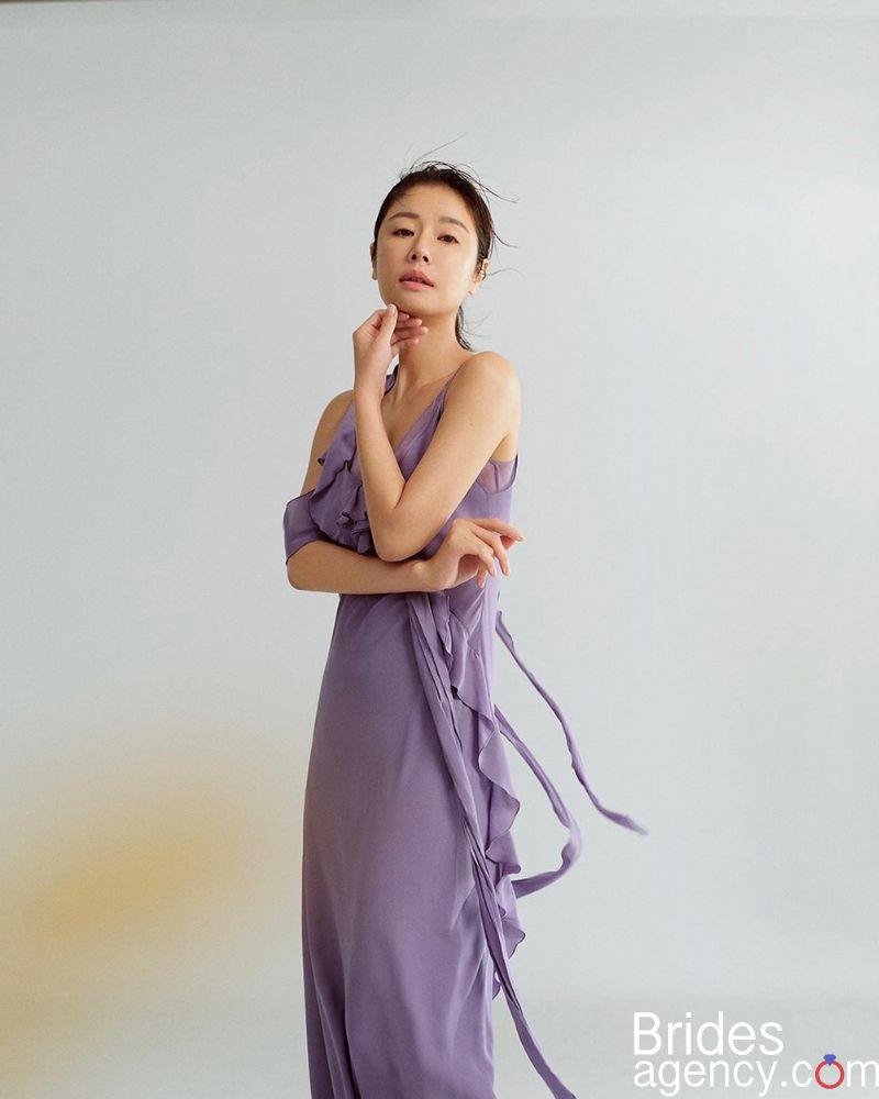 Ruby Lin in a long purple dress