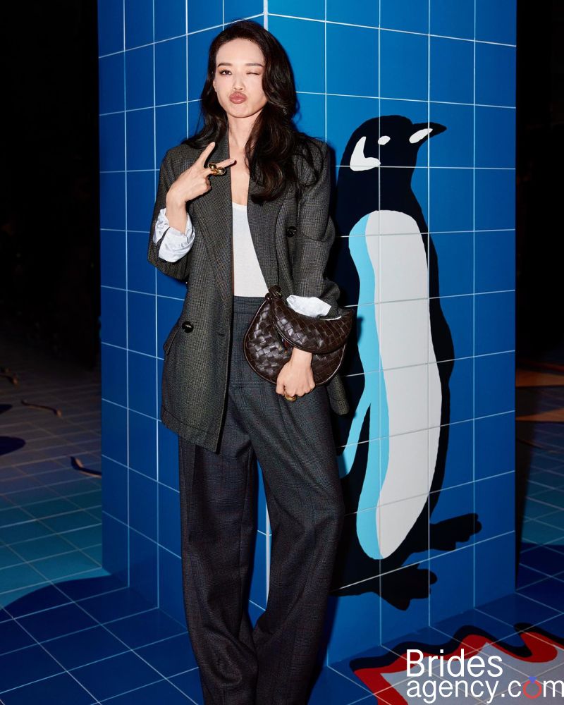 Shu Qi in black pantsuit and white shirt